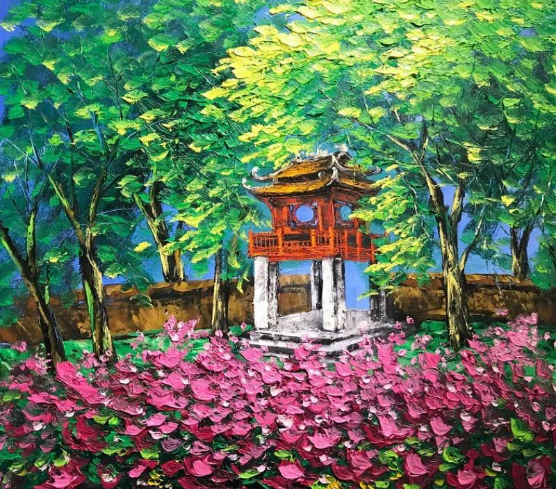 Khuê Văn Các thấp thoáng sau vườn hoa hồng rực rỡ buổi sớm mai Cre: Internet